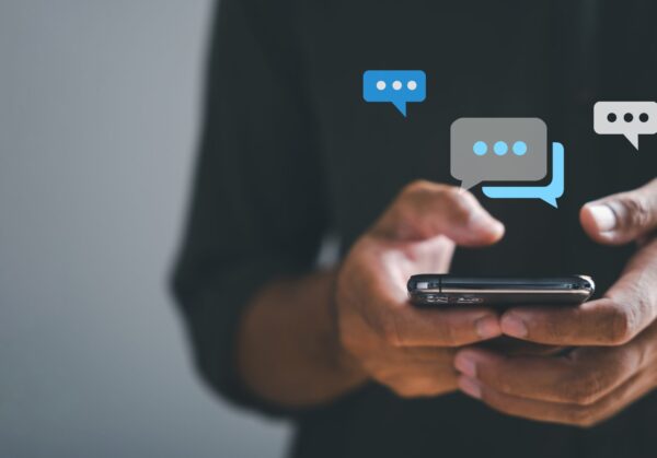 Man,Hand,Swiftly,Types,On,Smartphone,,Live,Chat,In,Progress,