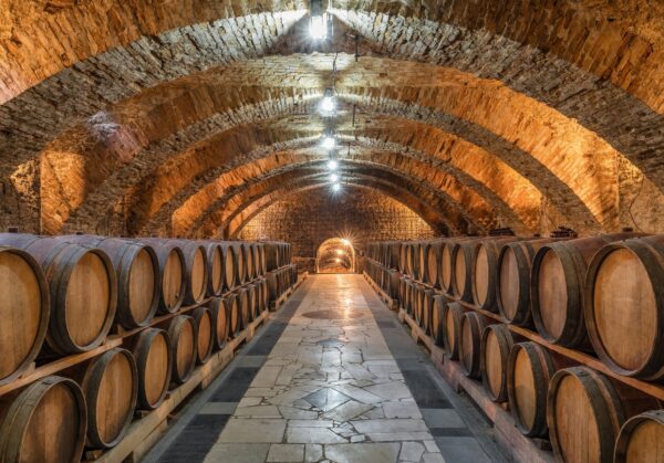 Old,Wooden,Barrels,With,Wine,In,The,Ancient,Medieval,Cellars.aged