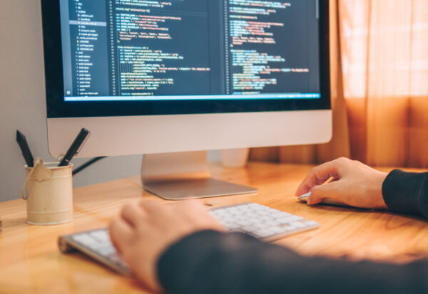 Close,Up,Hand,Of,Programmer,Man,Working,At,Home,With